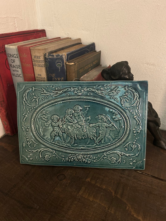 Late Victorian Green Glazed Relief Faience Plaque with Cherubs